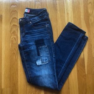 Dark washed patchy jeans